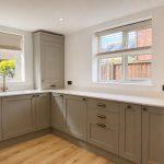 Quarts worktop with drainage grooves, shaker style cabinetry in Bishops Itchington kitchen transformation