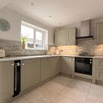 Updated kitchen quartz worktop with drainage grooves in Bishops Itchington
