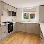 Quarts worktop with drainage grooves, shaker style cabinetry in Bishops Itchington kitchen transformation